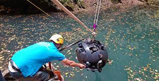 At the world's deepest cave pit, a robot aids researchers in breaking a record.