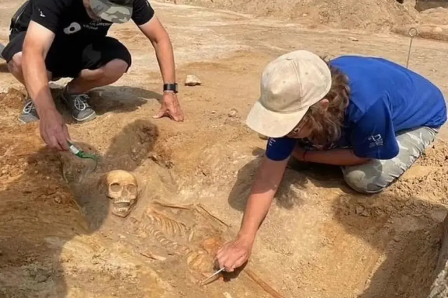 Archeologists discovering vampire child discovery