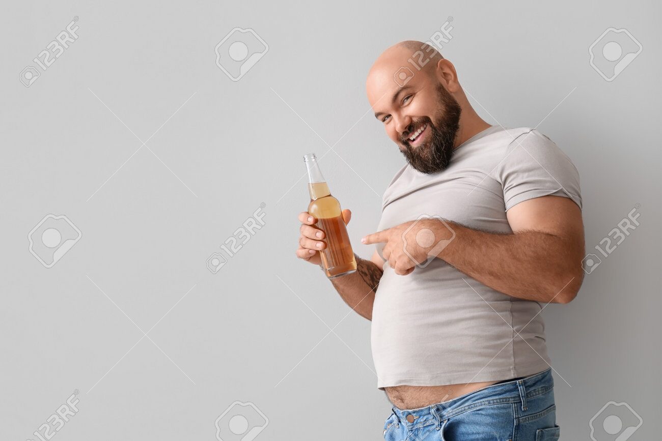 Bald man drinking alcohol