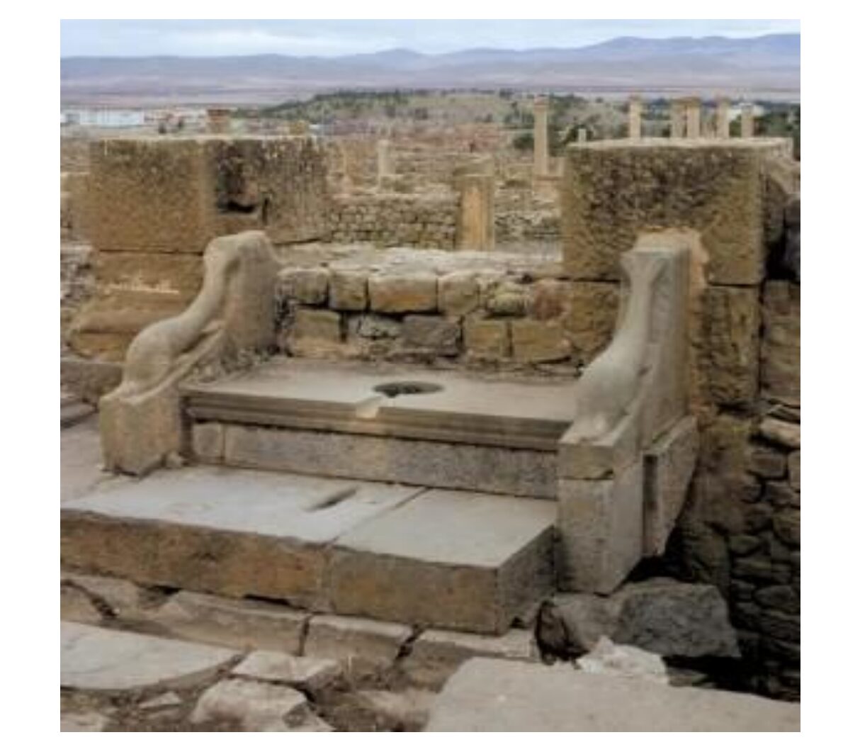 an ancient public latrine uncovered at the ruins in Timgad, Algeria