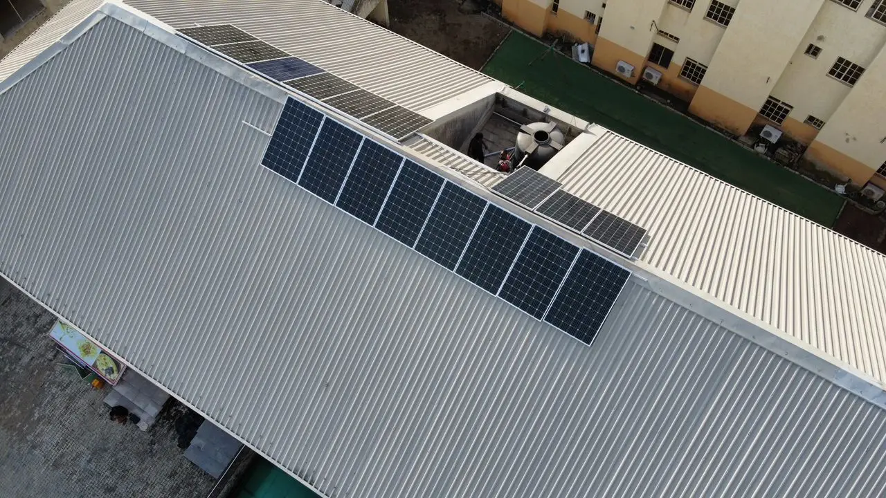 solar power system: installing solar panels on the roof of a house