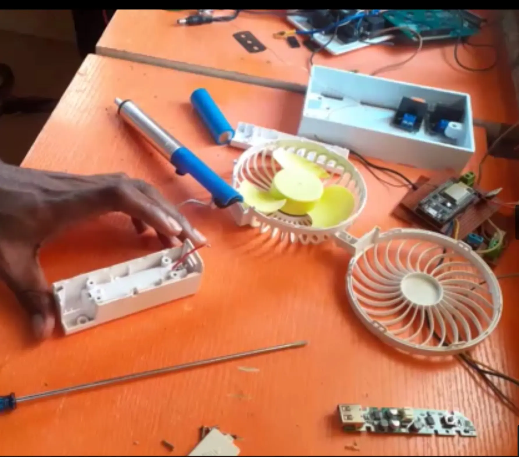 Disassembling the DC fan to take the needed parts for the project work